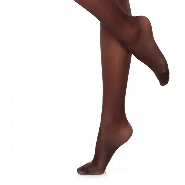 Legs and feet in sheer black stay-ups